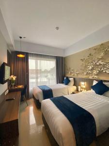 Phòng Hai Giường Đơn Loại Sang (Deluxe Twin Room)