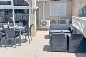 Spacious ground floor apartment overlooking the beautiful communal pool