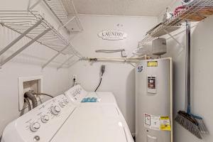 Dog-friendly home with fenced yard, patio, grill, & park across the street