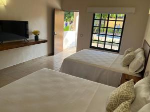 Natura Hotel & Villas