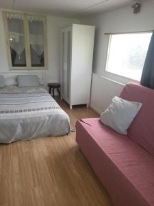 Appartements le bungalow au fond du jardin : photos des chambres