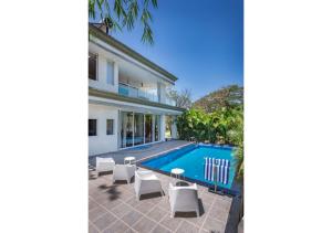 SaffronStays 7 Seas - 7BR pool villa with gazebo, bar & lawn, perfect for celebrations near Mandwa Jetty