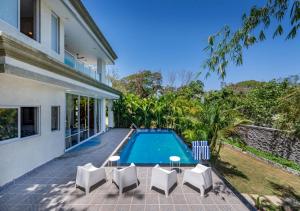 SaffronStays 7 Seas - 7BR pool villa with gazebo, bar & lawn, perfect for celebrations near Mandwa Jetty