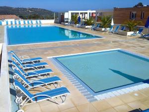 Maisons de vacances Carlandria - Charmante maisonnette avec piscine partagee : photos des chambres