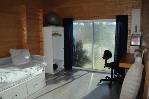 Maisons de vacances Wooden house by the sea : photos des chambres