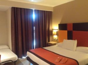 Family Room (2 Adults + 1 Child) room in Hotel Tiber