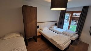 Appartements T3 rez-de-jardin avec fitness, sauna et tennis - village et ski a pied : photos des chambres