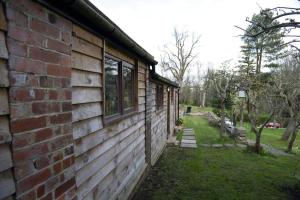 a quirky garden building in an orchard