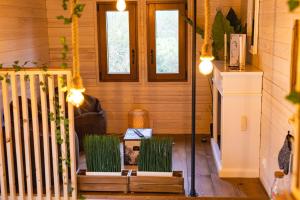 Maisons de vacances La tiny house exigue IJ : photos des chambres