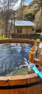 Borde Rio Coyhaique Cabaña y Tinaja