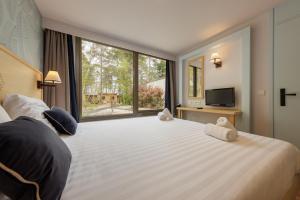 Villages vacances Center Parcs Les Hauts de Bruyeres : photos des chambres