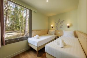 Villages vacances Center Parcs Les Hauts de Bruyeres : photos des chambres