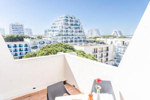 Appartements LE SEVENTIE'S 3*-Terrasse-Netflix-Wifi-Parking-Mer-CoHote Conciergerie : photos des chambres