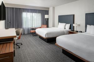 Queen Room with Two Queen Beds room in Courtyard by Marriott New Orleans Metairie