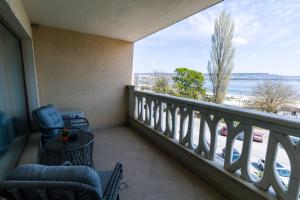 Seaside Serenity  luxurious beach front apartment with a refreshing pool