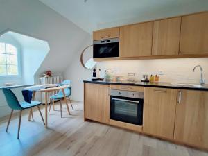 Appartements Les Suites - Saulieu : photos des chambres