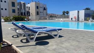 Sunny Luxury Apartment with two great sunny - level terraces, two swimming pools, in a new complex Pueblo Majorero, close to Fuerteventura Golf Club, next to the beach , Atlantico Shopping Mall and casino in Caleta de Fuste