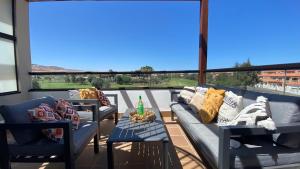 Sunny Luxury Apartment with two great sunny - level terraces, two swimming pools, in a new complex Pueblo Majorero, close to Fuerteventura Golf Club, next to the beach , Atlantico Shopping Mall and casino in Caleta de Fuste