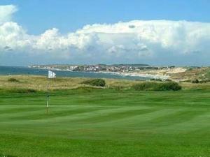 Vue sur mer, dunes et golf