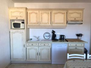 Appartements Les palmiers : photos des chambres