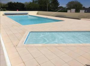 Maisons de vacances Maisonnette avec piscine : photos des chambres