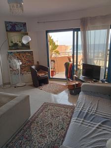 Studio calme vue mer pieds dans leau