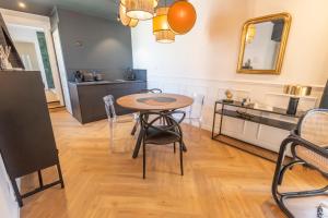 Appartements Le Cosy Chic . Proche gare . Centre-ville Macon . Neuf . Climatisation . Design . Wifi . : photos des chambres