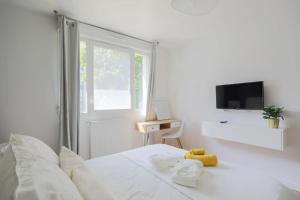 Appartements HolyHome Limeil - Appartement avec baignoire spa Balneo : photos des chambres