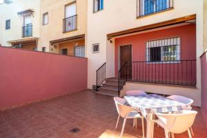 Adosado con vistas al mar desde la piscina con BBQ