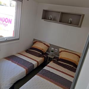 Campings Mobil-Home Clos 14 a VIAS : photos des chambres