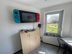 Appartements Studio petit plus gaming ! : photos des chambres