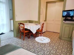 Appartements Appartement avec balcon / jardin : photos des chambres