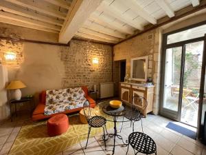 Appartements La maison jaune avec terrasse : photos des chambres