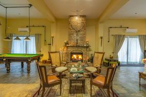 StayVista at Peacocks & Partridges with Amidst Greenery, Terrace, Indoor Fireplace, Bar & Snooker Table