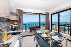 Islet Promenade Seafront Apartment with large Corner Terrace by Getawaysmalta