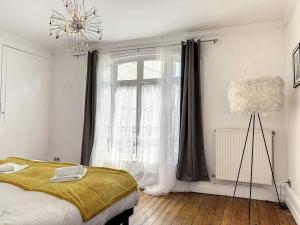 Appartements Le Trouvill'Art - YourHostHelper : photos des chambres