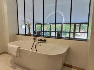 Appartements Le Jardin Secret - Piscine - Clim - Haut de gamme : photos des chambres