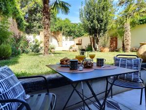 Appartements Le Jardin Secret - Piscine - Clim - Haut de gamme : photos des chambres