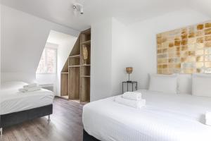 Maisons de vacances Square-bnb - La Maison Pasteque a 8min de Disney : photos des chambres