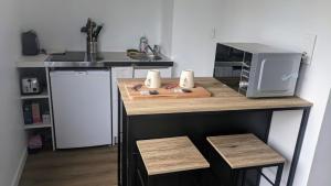 Appartements au Coeur de Maine : photos des chambres