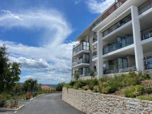 Appartements L'ecrin des Oliviers : photos des chambres