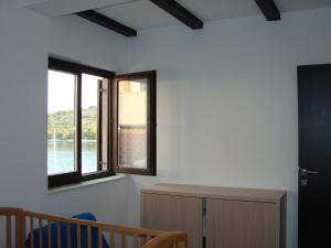 Apartments by the sea Kaprije - 20012