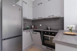 Family Apartment with Parking & Terrace by Noclegi Renters