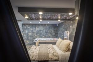 Appartements L'Eden Love - Jacuzzi / Sauna : photos des chambres