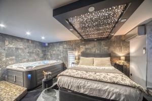 Appartements L'Eden Love - Jacuzzi / Sauna : photos des chambres