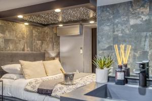 Appartements L'Eden Love - Jacuzzi / Sauna : photos des chambres