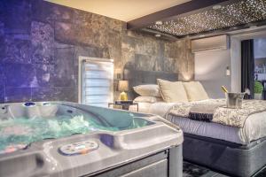 Appartements L'Eden Love - Jacuzzi / Sauna : photos des chambres