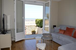 Maisons de vacances L'Estran - maison sur la digue avec vue mer : photos des chambres