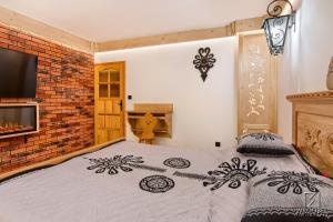 Apartament Zakopane utrzymany w stylu góralskiej chaty