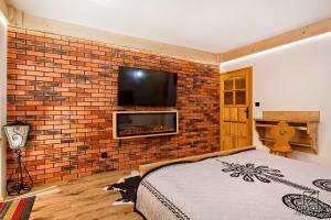 Apartament Zakopane utrzymany w stylu góralskiej chaty